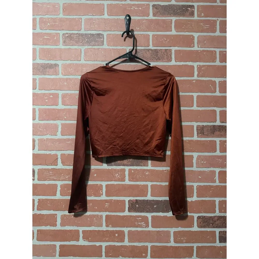 NWT/NWOT Calia long sleeve ruched swim rashguard in a red brown/copper color